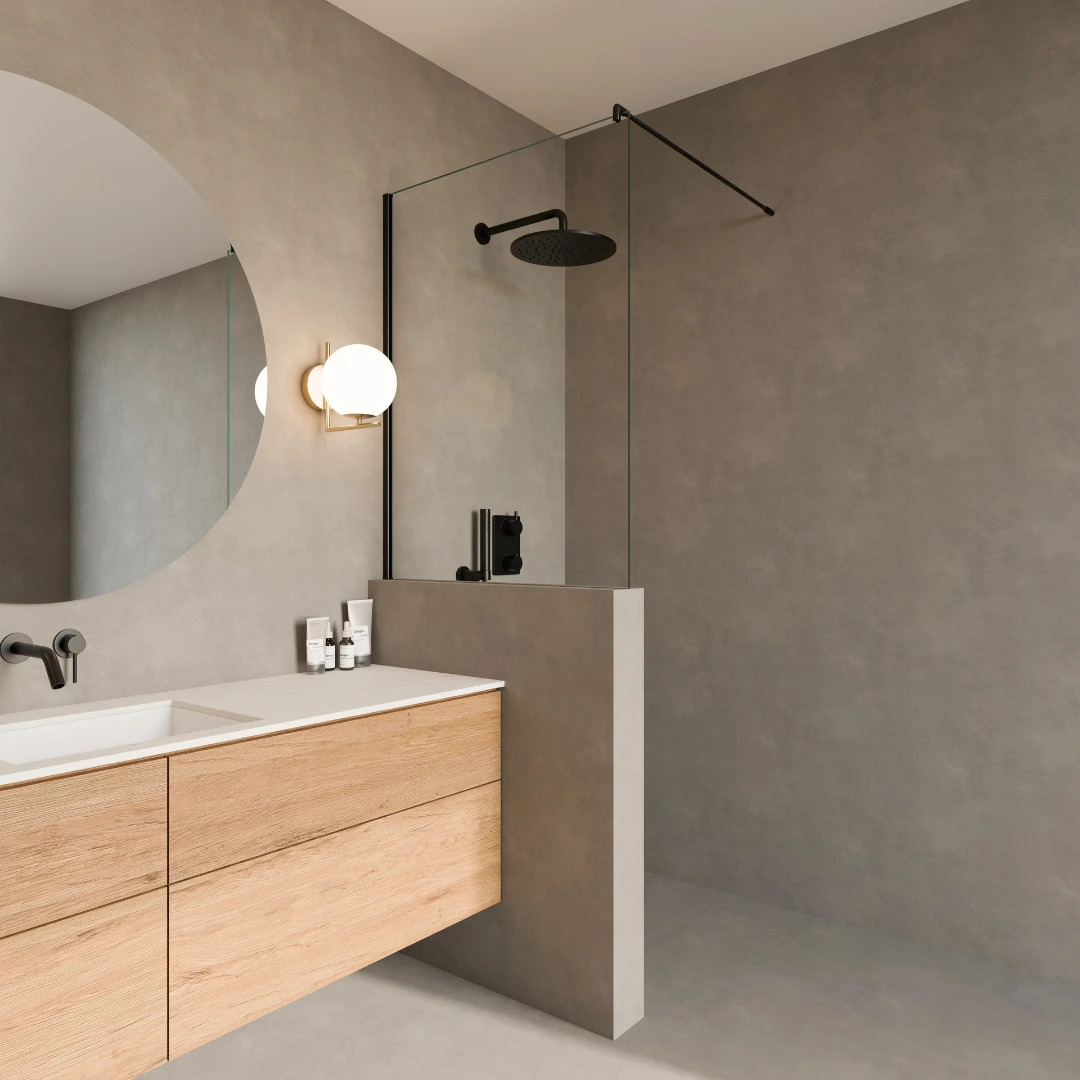 Walk In Dusche mit halbhoher Mauer aus Klarglas und schwarzen Beschlägen